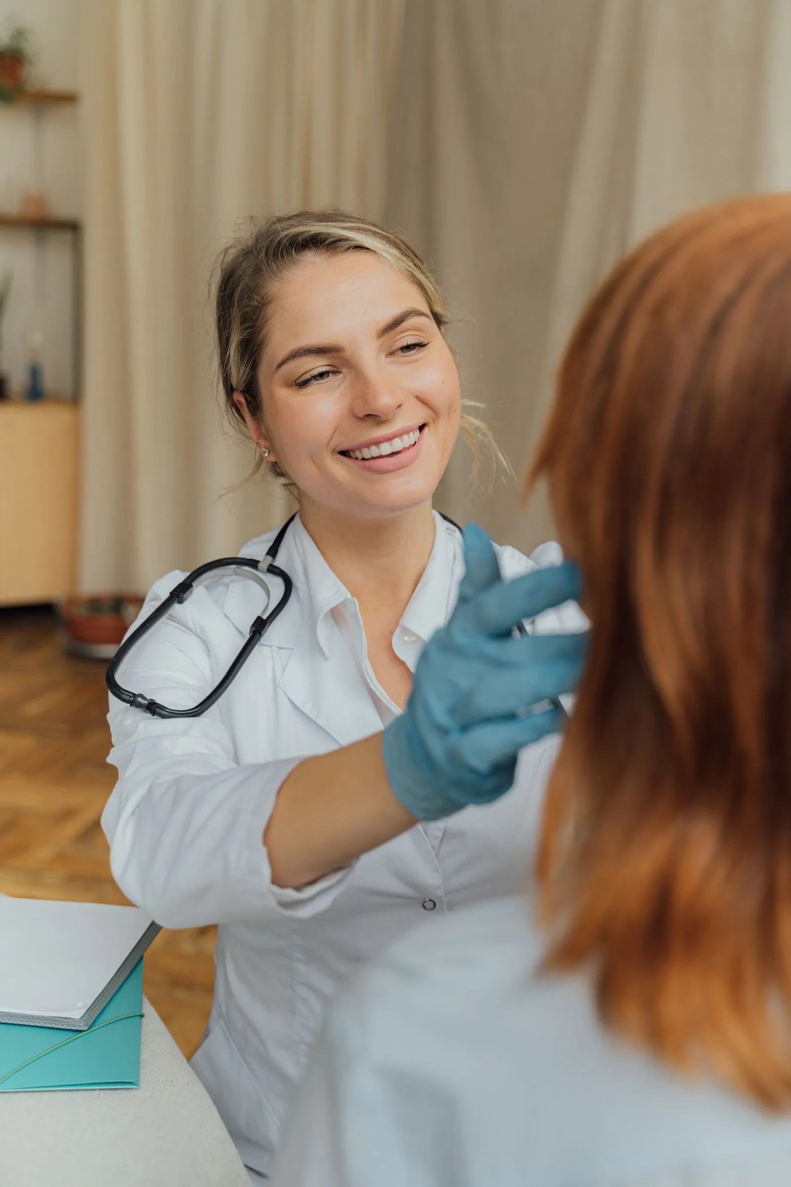 A nurse preparing care supplies with a smile